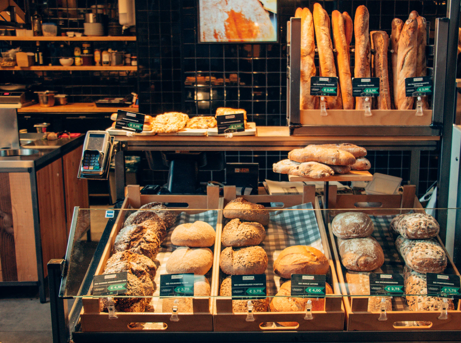 Bakery display case with breads and pastries